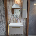 فولست روشویی همراه با آینه‌ بیضی‌شکل بدون قاب با نورپردازی مخفی